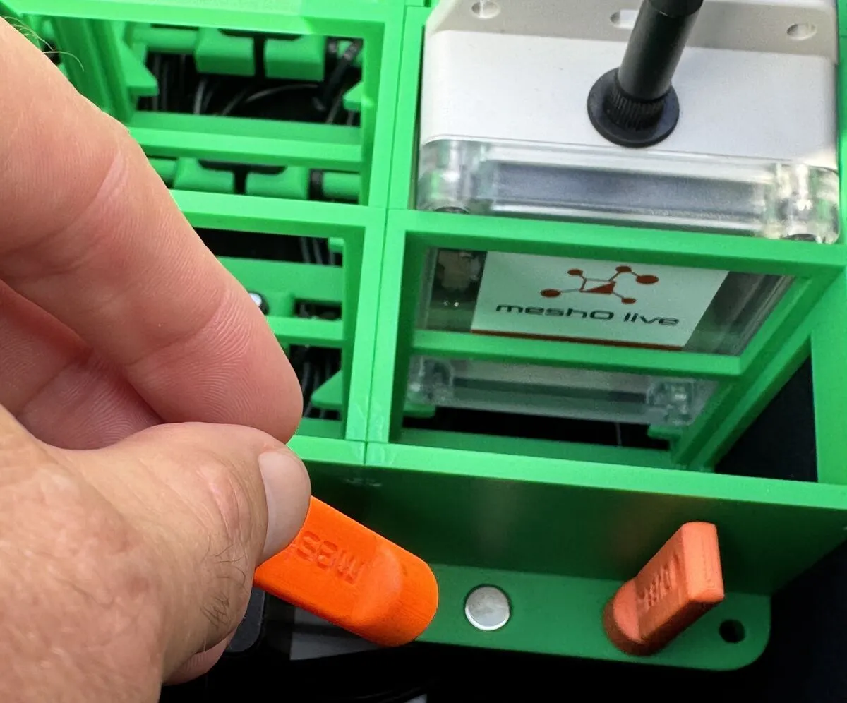 meshO Controls in the case with their magnetic charging cables