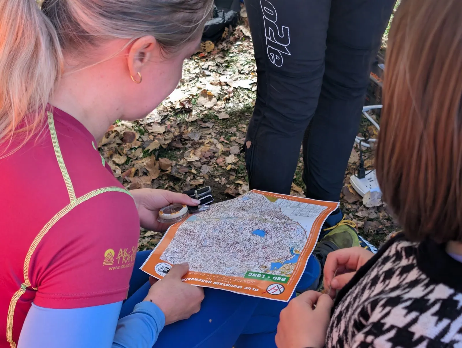 Runners studying a map together