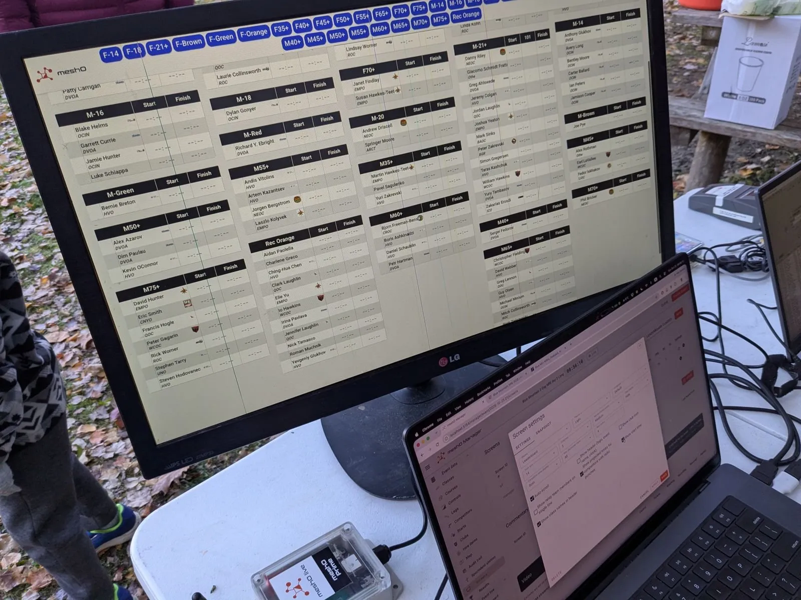 Live results on the arena screen on Sunday, with the Manager laptop in front